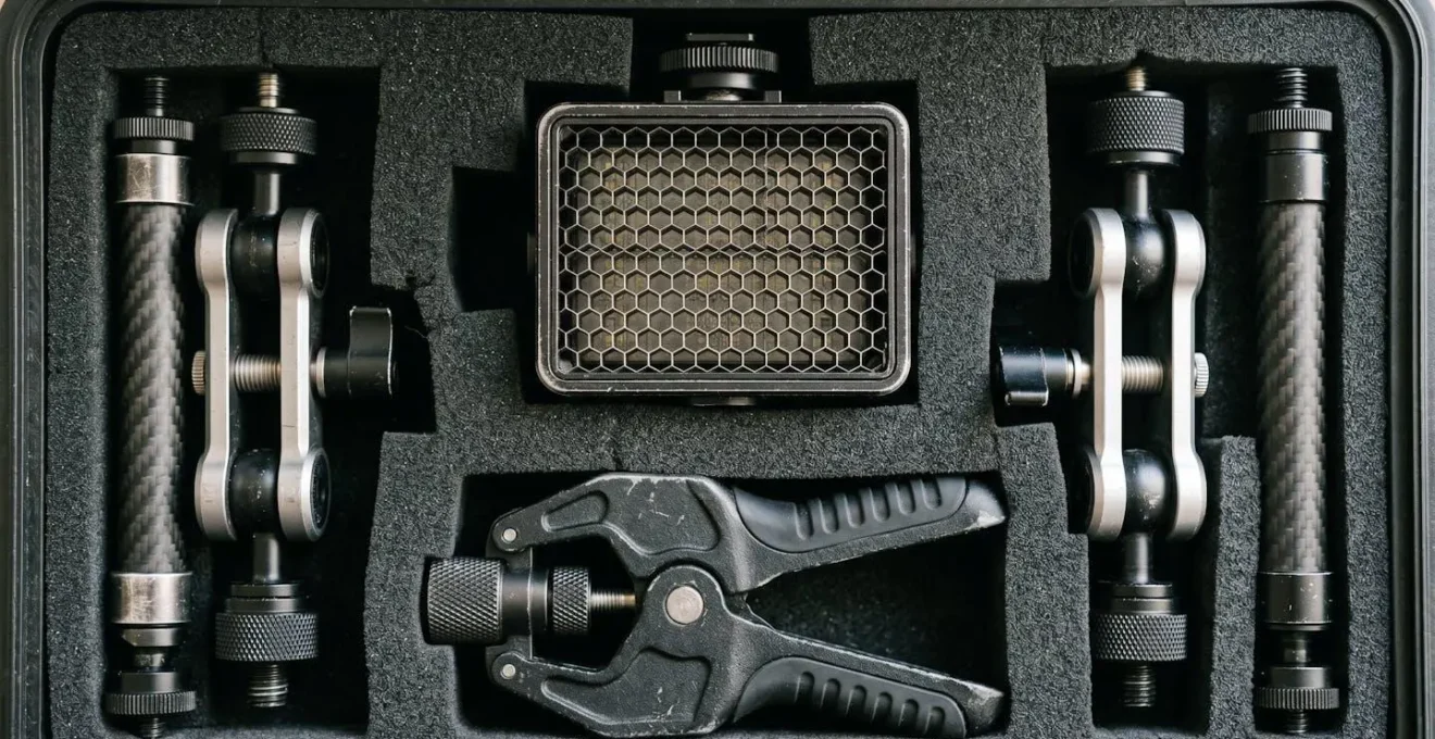 Extreme close-up of precisely arranged LED panels, clamps, and diffusion materials nested inside protective foam